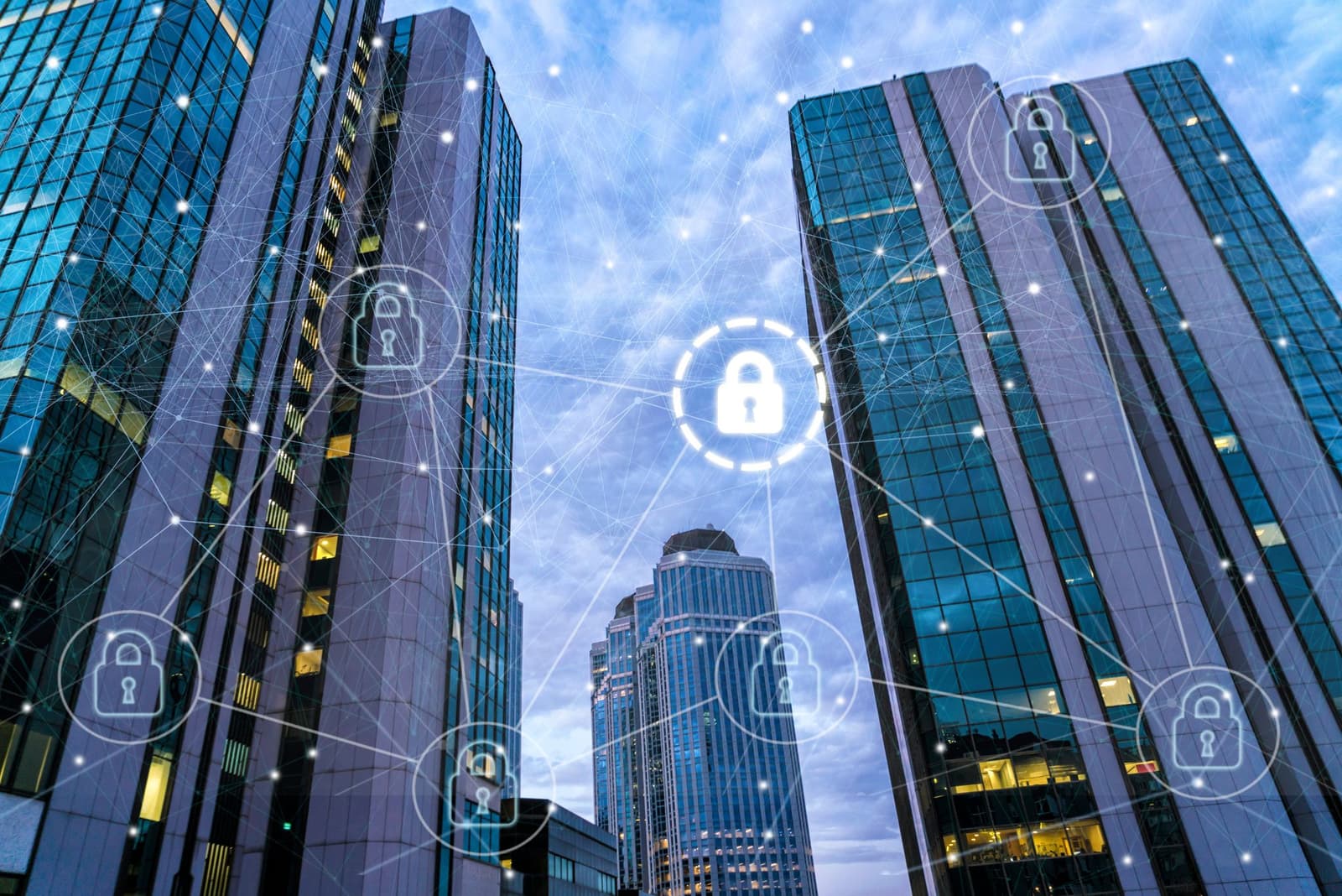 directive nis 2 : image de tours à bureaux avec une superposition de cadenas digitaux.